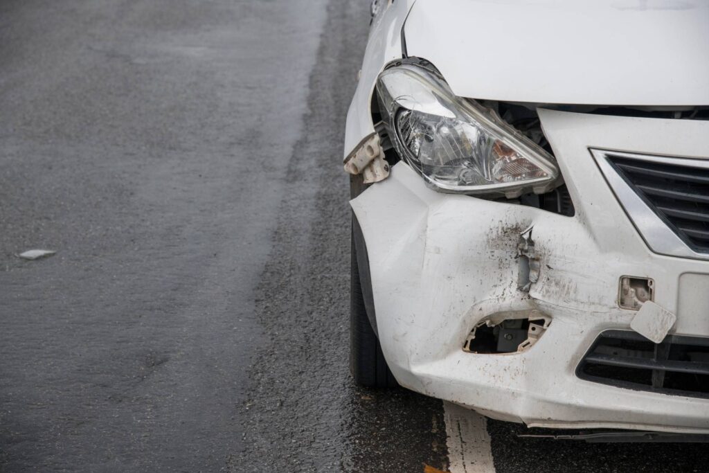  a cracked car bumper near the adas sensor area, highlighting safety concerns during resale.